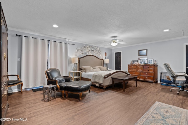 140 One Down St, Southern Pines, NC 28387 - bedroom with ornamental molding, wood finished floors, a textured ceiling, recessed lighting, and a ceiling fan