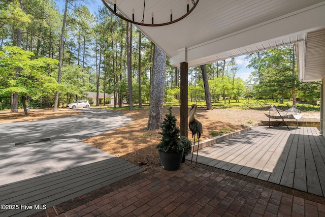 140 One Down St, Southern Pines, NC 28387 - wooden terrace with view of wooded area