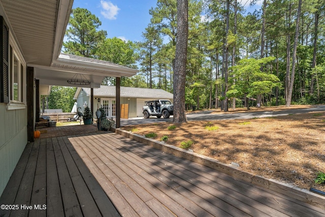 140 One Down St, Southern Pines, NC 28387 - wooden terrace featuring driveway, a garage, and french doors