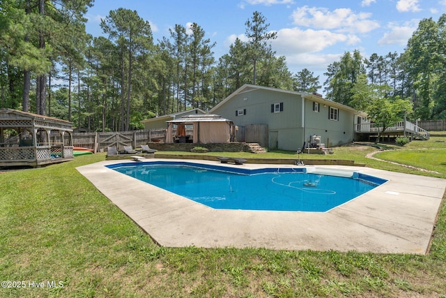 140 One Down St, Southern Pines, NC 28387 - view of pool with a gazebo, a wooden deck, a diving board, and view of wooded area