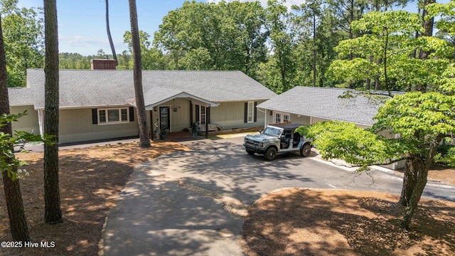 140 One Down St, Southern Pines, NC 28387 - ranch-style house with asphalt driveway, a shingled roof, and a chimney