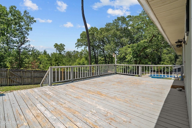 140 One Down St, Southern Pines, NC 28387 - deck with a fenced backyard and view of wooded area