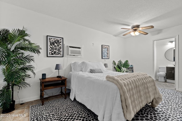 140 One Down St, Southern Pines, NC 28387 - bedroom with ensuite bath, a wall mounted AC, and baseboards