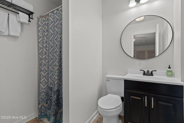 140 One Down St, Southern Pines, NC 28387 - bathroom with vanity, toilet, baseboards, and a shower with curtain