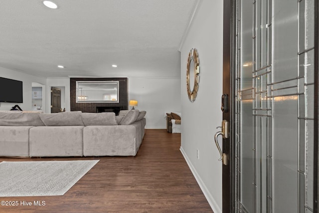 140 One Down St, Southern Pines, NC 28387 - living area featuring baseboards, dark wood-style floors, recessed lighting, and a textured ceiling
