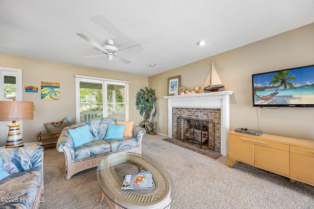 1137 Indigo Cir, Sunset Beach, NC 28468 - living area with light carpet, a ceiling fan, a textured ceiling, and a brick fireplace