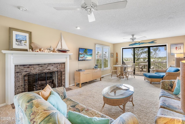 1137 Indigo Cir, Sunset Beach, NC 28468 - living area with carpet, a ceiling fan, a textured ceiling, a brick fireplace, and baseboards
