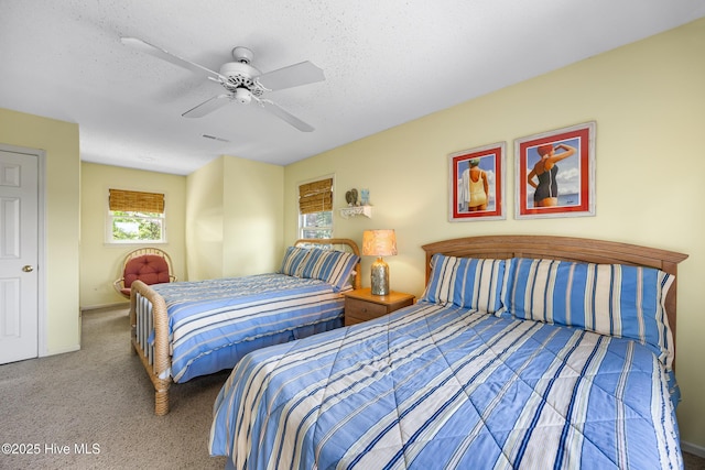 1137 Indigo Cir, Sunset Beach, NC 28468 - carpeted bedroom with a ceiling fan, a textured ceiling, and baseboards
