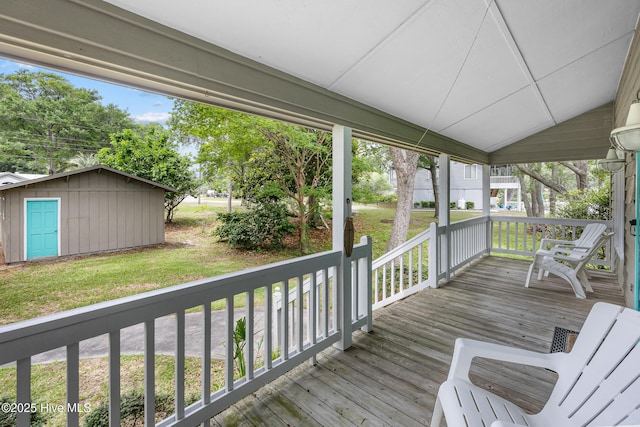 1137 Indigo Cir, Sunset Beach, NC 28468 - wooden porch featuring a yard and an outbuilding