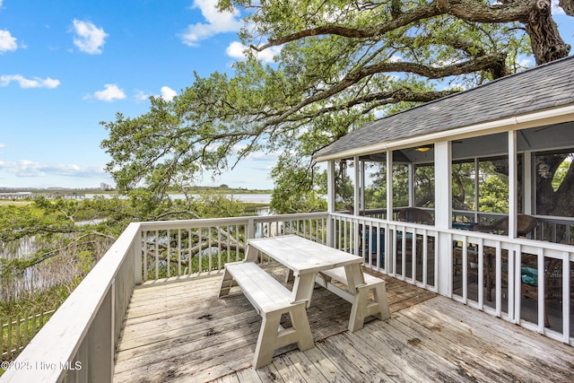 1137 Indigo Cir, Sunset Beach, NC 28468 - wooden deck with a sunroom and outdoor dining space