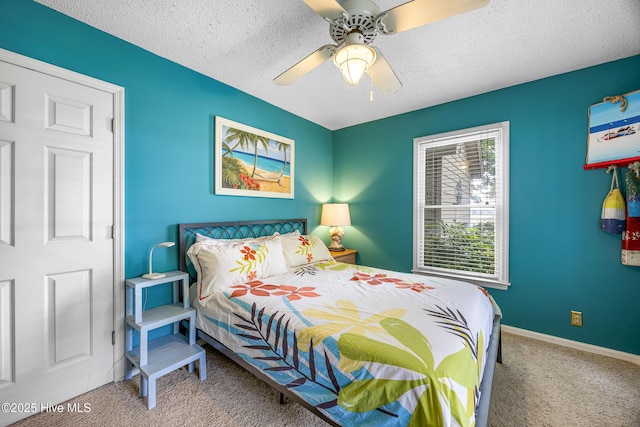 1137 Indigo Cir, Sunset Beach, NC 28468 - carpeted bedroom featuring a textured ceiling, ceiling fan, and baseboards
