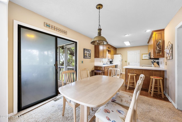 1137 Indigo Cir, Sunset Beach, NC 28468 - dining room featuring baseboards, recessed lighting, and light wood-type flooring