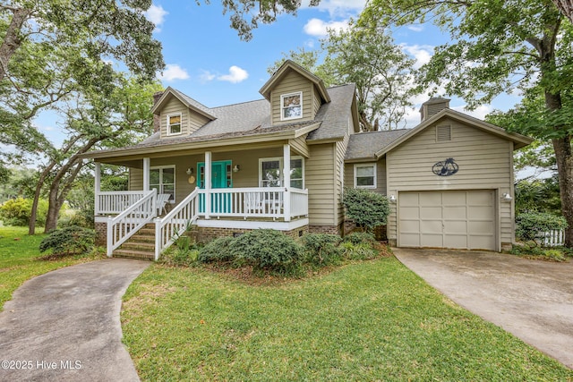 1137 Indigo Cir, Sunset Beach, NC 28468 - view of front of property featuring covered porch, concrete driveway, roof with shingles, a garage, and a front yard
