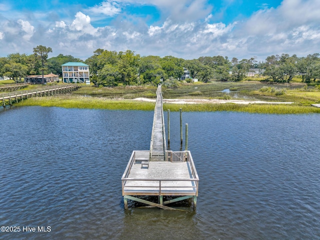 1137 Indigo Cir, Sunset Beach, NC 28468 - dock area featuring a water view and view of scattered trees