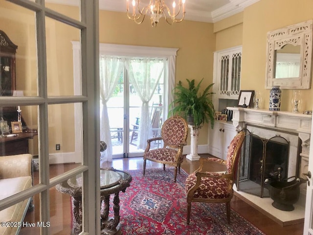 601 Saint Patrick St, Tarboro, NC 27886 - sitting room featuring a chandelier, crown molding, and a premium fireplace
