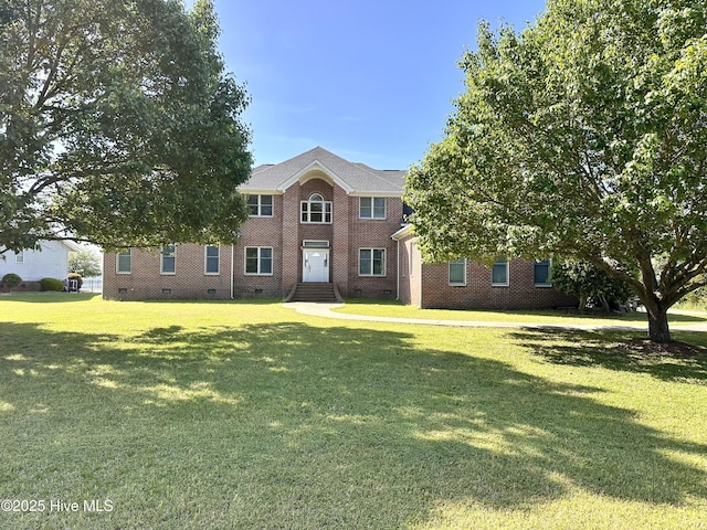 141 Baybreeze Dr, Shiloh, NC 27974 - view of front facade featuring crawl space, a front lawn, and brick siding