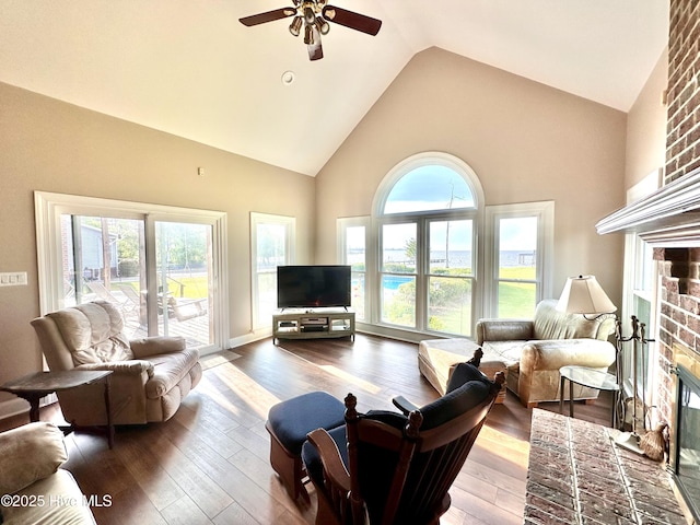 141 Baybreeze Dr, Shiloh, NC 27974 - living room with a brick fireplace, ceiling fan, high vaulted ceiling, healthy amount of natural light, and hardwood / wood-style floors