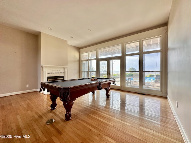 141 Baybreeze Dr, Shiloh, NC 27974 - game room featuring light wood-type flooring, pool table, a fireplace, and baseboards