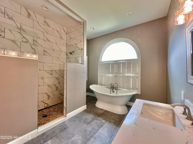 141 Baybreeze Dr, Shiloh, NC 27974 - bathroom featuring walk in shower, a freestanding tub, baseboards, vanity, and recessed lighting