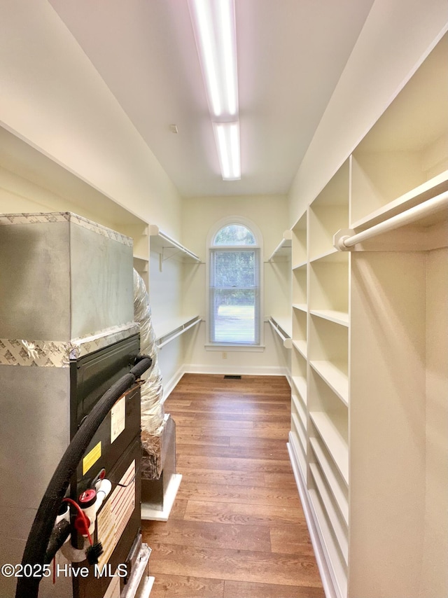 141 Baybreeze Dr, Shiloh, NC 27974 - walk in closet featuring wood finished floors