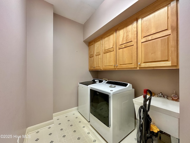 141 Baybreeze Dr, Shiloh, NC 27974 - laundry room with washer and clothes dryer, cabinet space, baseboards, and light tile patterned floors
