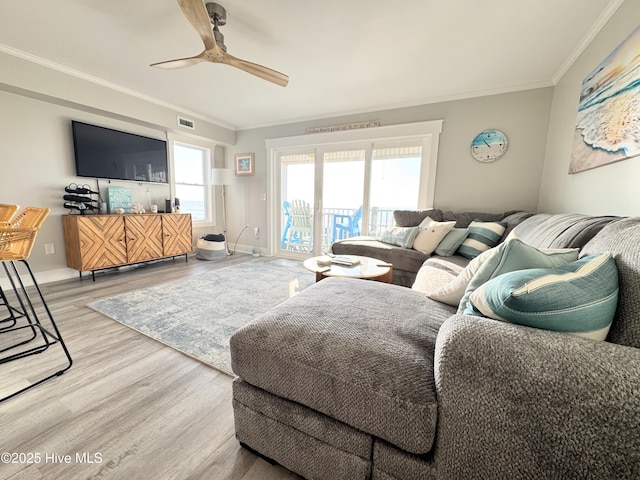 702 Carolina Beach Ave N Unit 3A, Carolina Beach, NC 28428 - living room with ceiling fan, wood finished floors, and crown molding