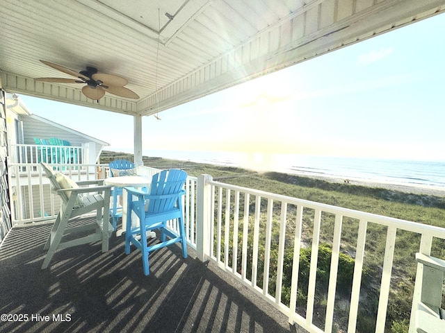 702 Carolina Beach Ave N Unit 3A, Carolina Beach, NC 28428 - balcony featuring ceiling fan, view of water and beach, and outdoor dining area