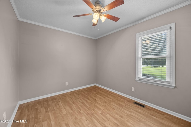 114 Maid Marian Ln, Washington, NC 27889 - spare room with light wood-type flooring, a ceiling fan, a textured ceiling, and crown molding
