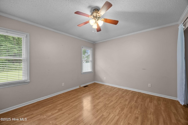 114 Maid Marian Ln, Washington, NC 27889 - spare room with light wood-style flooring, a textured ceiling, ceiling fan, and crown molding