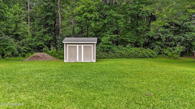 114 Maid Marian Ln, Washington, NC 27889 - view of green lawn featuring a storage shed and a view of trees