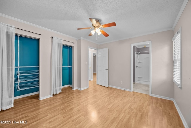 114 Maid Marian Ln, Washington, NC 27889 - unfurnished bedroom with light wood-type flooring, a textured ceiling, ornamental molding, and a ceiling fan