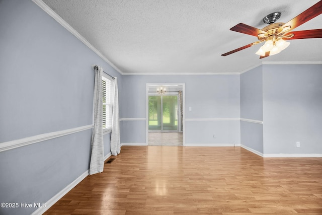 114 Maid Marian Ln, Washington, NC 27889 - unfurnished room featuring a chandelier, a textured ceiling, wood finished floors, crown molding, and ceiling fan
