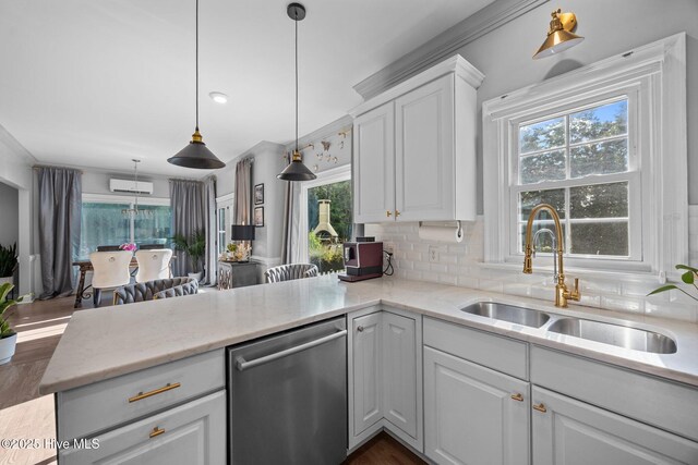 2221 Greaves Ct, Winterville, NC 28590 - kitchen with stainless steel dishwasher, healthy amount of natural light, white cabinets, a peninsula, and crown molding