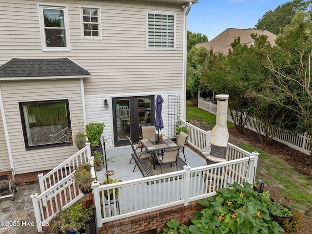 2221 Greaves Ct, Winterville, NC 28590 - rear view of property with french doors, a patio area, roof with shingles, and outdoor dining space