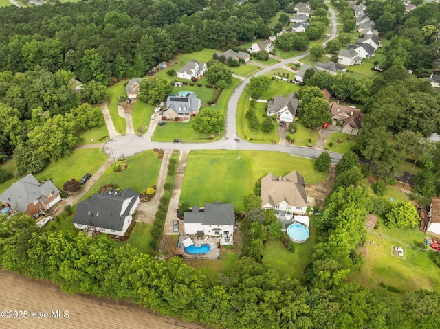 2221 Greaves Ct, Winterville, NC 28590 - aerial perspective of suburban area featuring a pool area