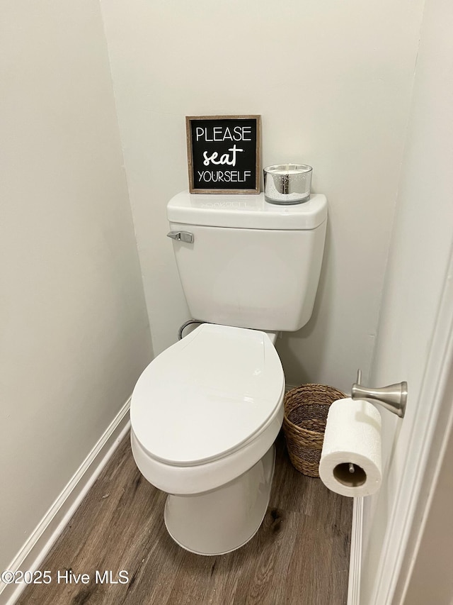 417 S Herman St, Goldsboro, NC 27530 - bathroom with wood finished floors, toilet, and baseboards