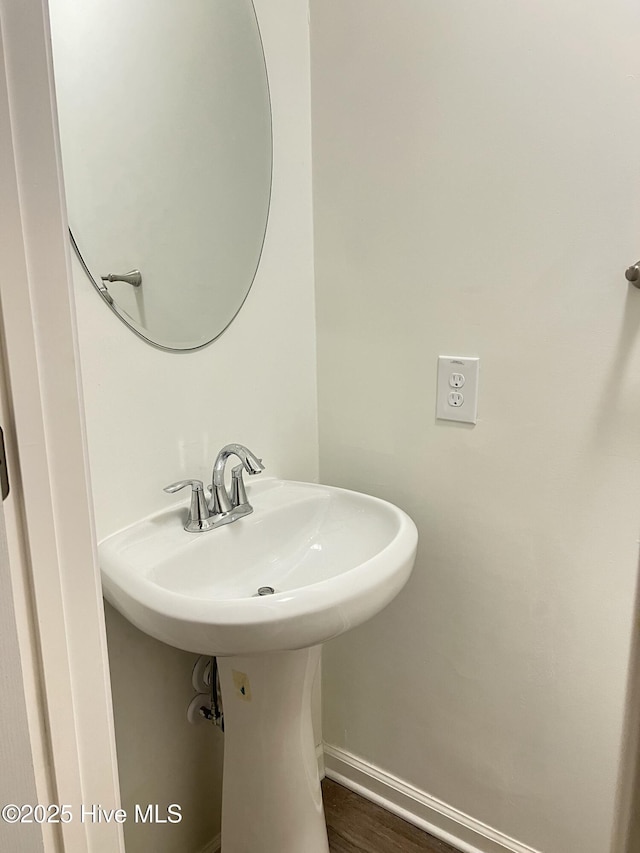 417 S Herman St, Goldsboro, NC 27530 - bathroom with a sink and baseboards