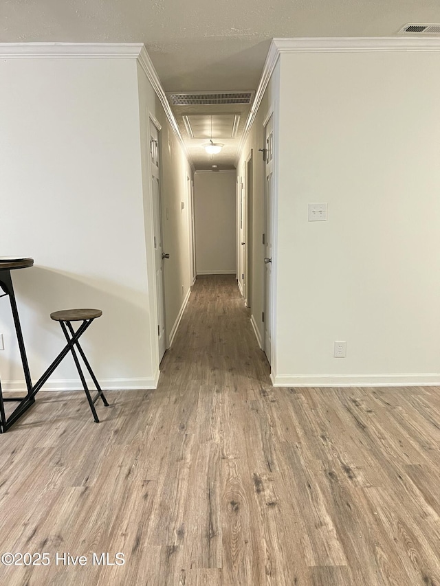 417 S Herman St, Goldsboro, NC 27530 - hall featuring attic access, wood finished floors, crown molding, and baseboards
