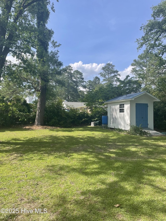 958 Holly Rd, Lakeview, NC 28350 - view of green lawn with a shed