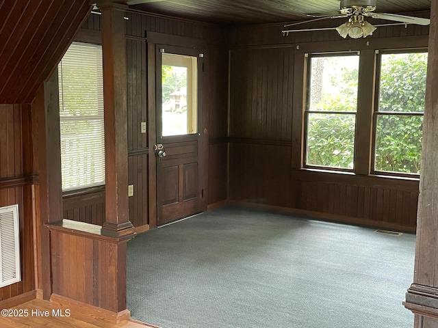 958 Holly Rd, Lakeview, NC 28350 - carpeted entrance foyer featuring wood walls, a ceiling fan, and wooden ceiling