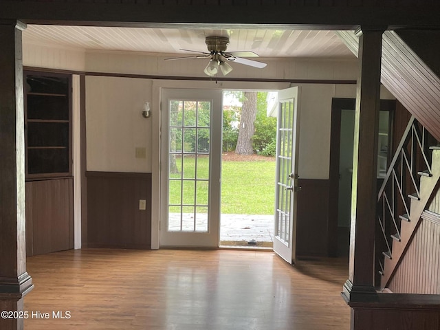 958 Holly Rd, Lakeview, NC 28350 - doorway to outside with a ceiling fan, wood finished floors, wood walls, and stairway