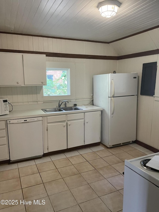 958 Holly Rd, Lakeview, NC 28350 - kitchen with white appliances, light countertops, lofted ceiling, white cabinetry, and light tile patterned floors