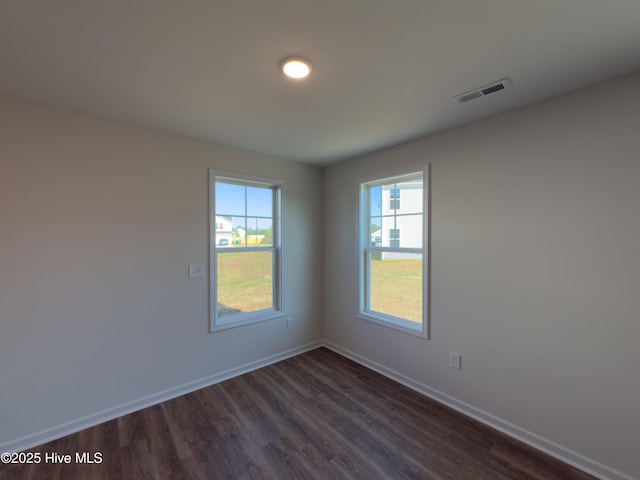 2215 Roadster Pony Ln, Hope Mills, NC 28348 - empty room with dark wood-type flooring and baseboards