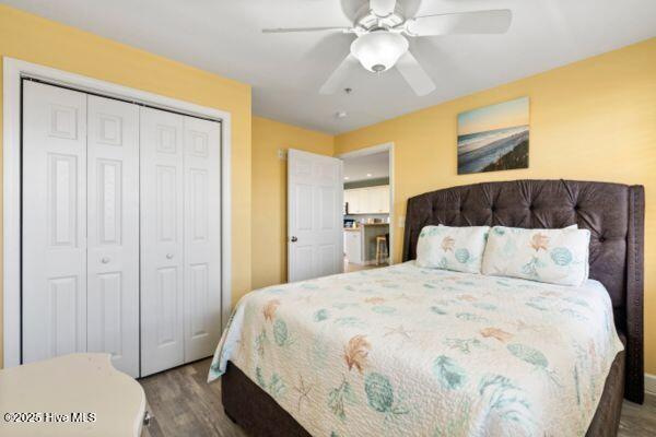 1505 N New River Dr Unit 210, Surf City, NC 28445 - bedroom featuring wood finished floors, a closet, and ceiling fan