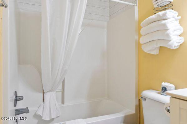 1505 N New River Dr Unit 210, Surf City, NC 28445 - bathroom featuring shower / bath combo with shower curtain, toilet, and vanity
