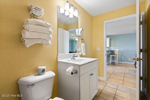 1505 N New River Dr Unit 210, Surf City, NC 28445 - bathroom with toilet, vanity, tile patterned floors, and baseboards