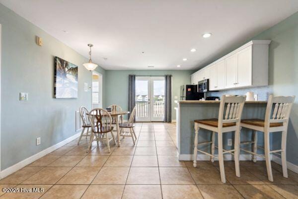 1505 N New River Dr Unit 210, Surf City, NC 28445 - dining room with baseboards, light tile patterned flooring, and recessed lighting