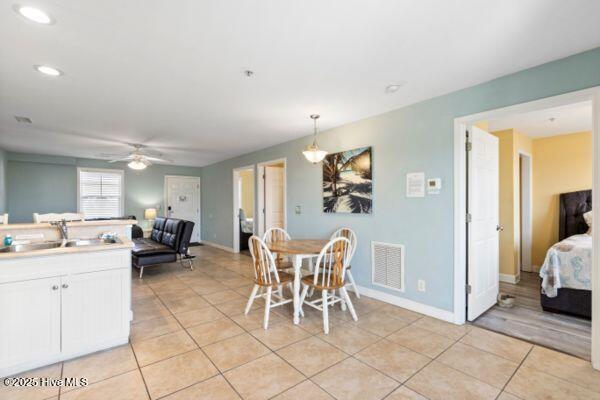 1505 N New River Dr Unit 210, Surf City, NC 28445 - dining area with light tile patterned flooring, ceiling fan, baseboards, and recessed lighting