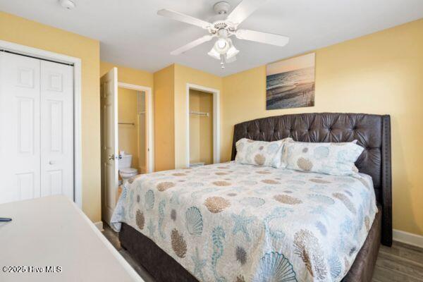 1505 N New River Dr Unit 210, Surf City, NC 28445 - bedroom featuring wood finished floors, baseboards, ceiling fan, and a closet