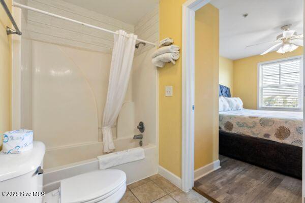 1505 N New River Dr Unit 210, Surf City, NC 28445 - full bath with toilet, shower / bath combination with curtain, ensuite bath, ceiling fan, and baseboards